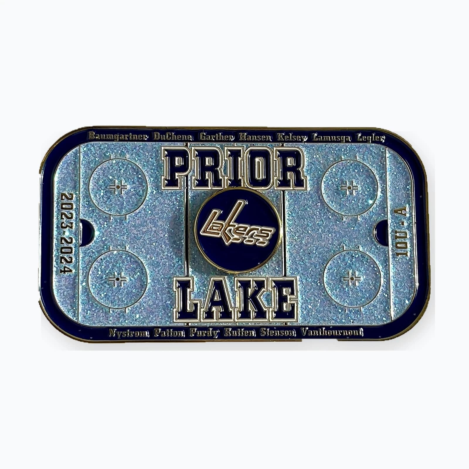 A rink-shaped Prior Lake trading pin in silver and white