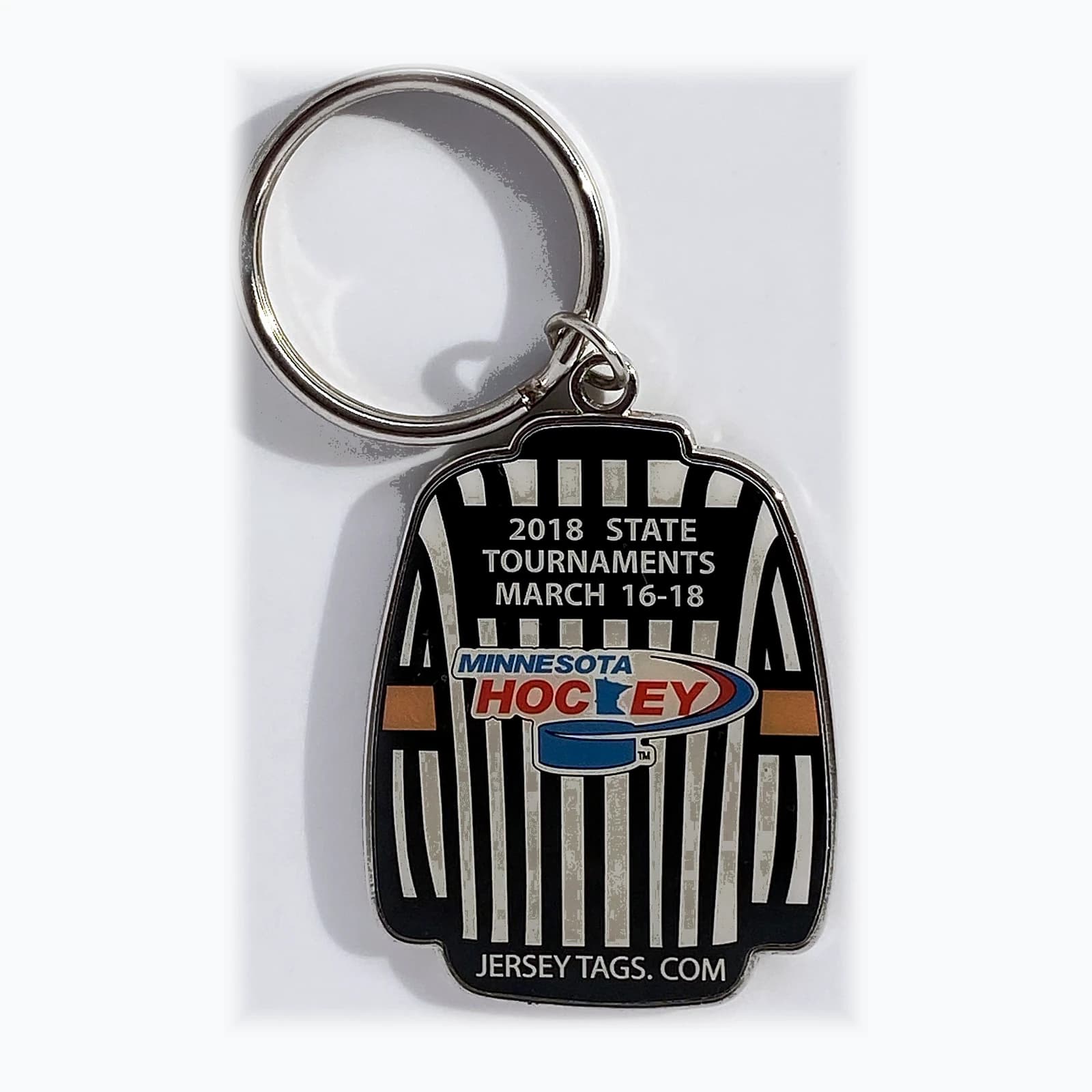 A key ring shaped like a referee, made for a state tournament