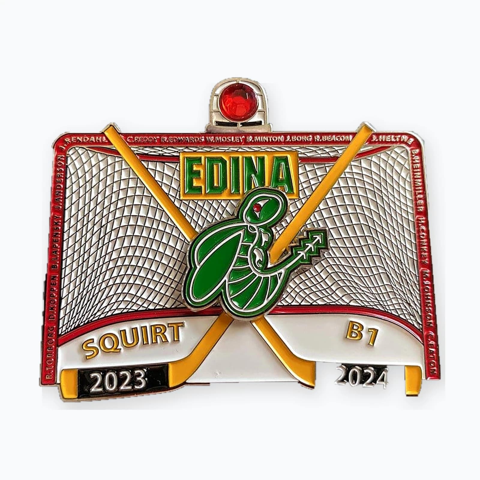 An Edina Squirt B1 trading pin shaped like a hockey net, with a green hornet spinner at the center