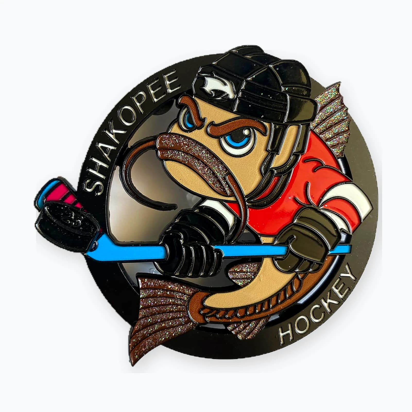 A Shakopee hockey trading pin with a sabretooth mascot