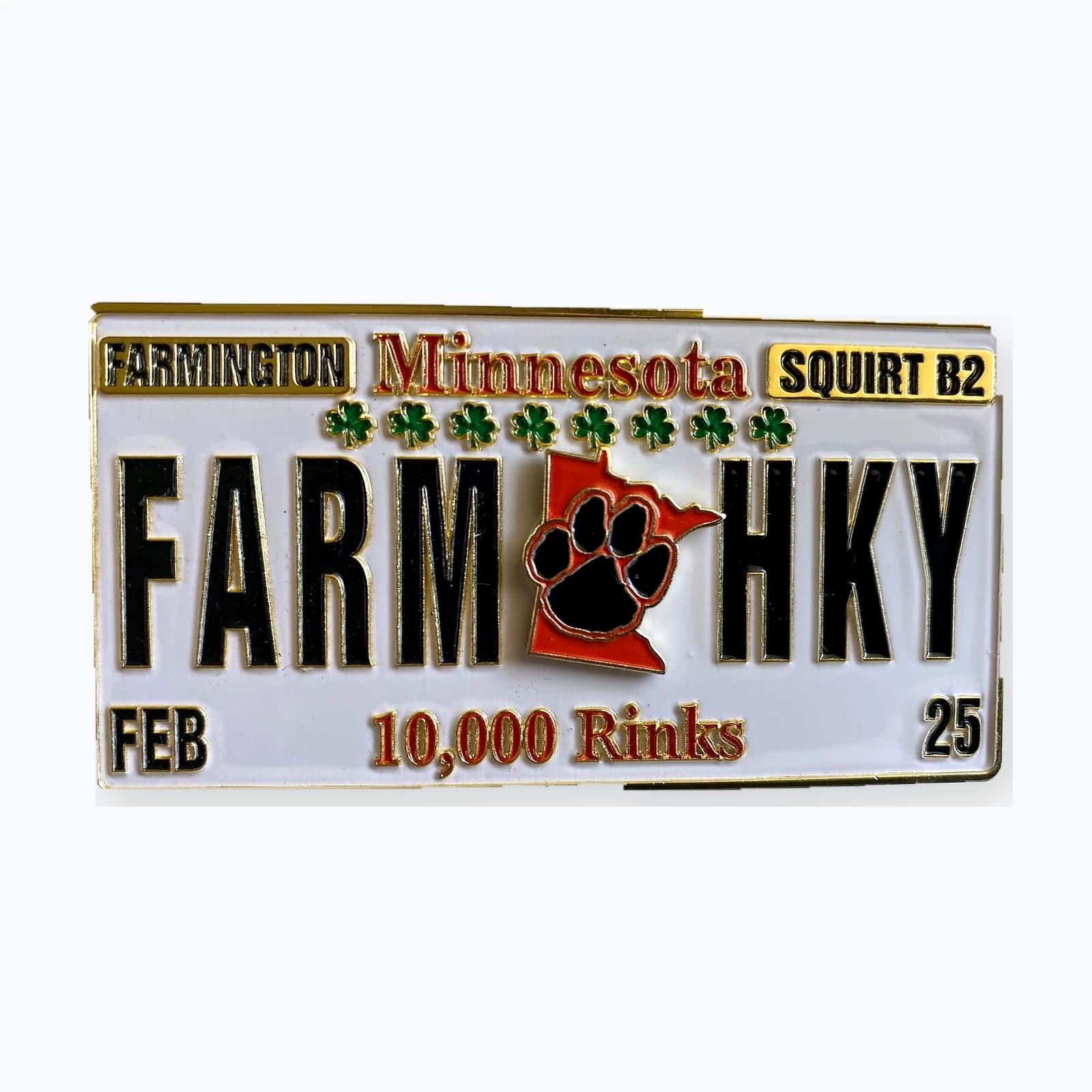 A trading pin shaped like a Minnesota license plate reading FARM HKY