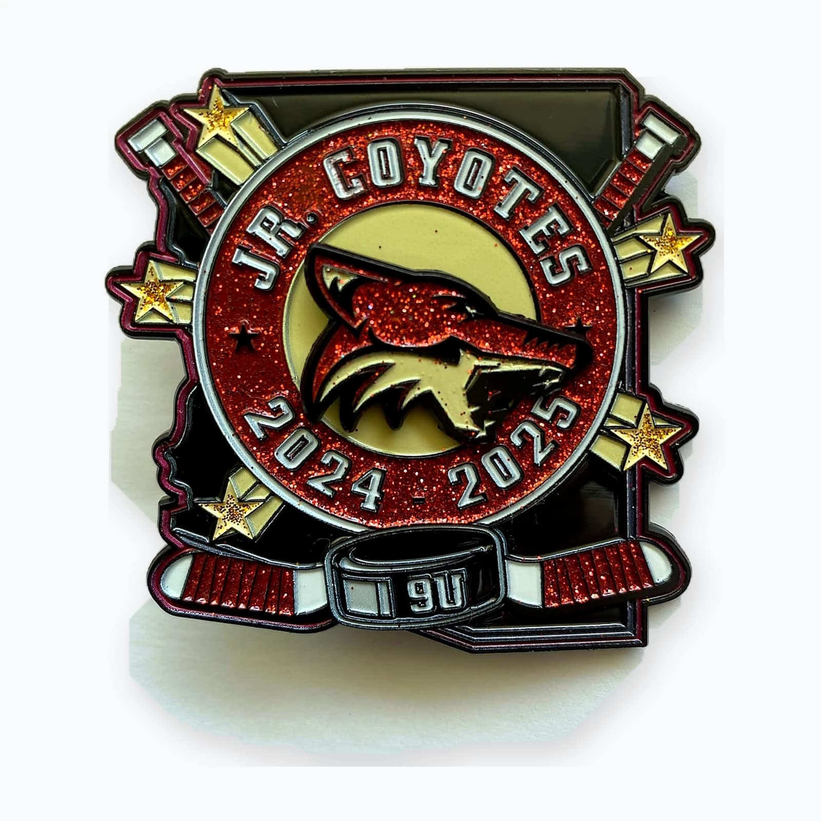 A Jr Coyotes 9U trading pin with a coyote mascot
