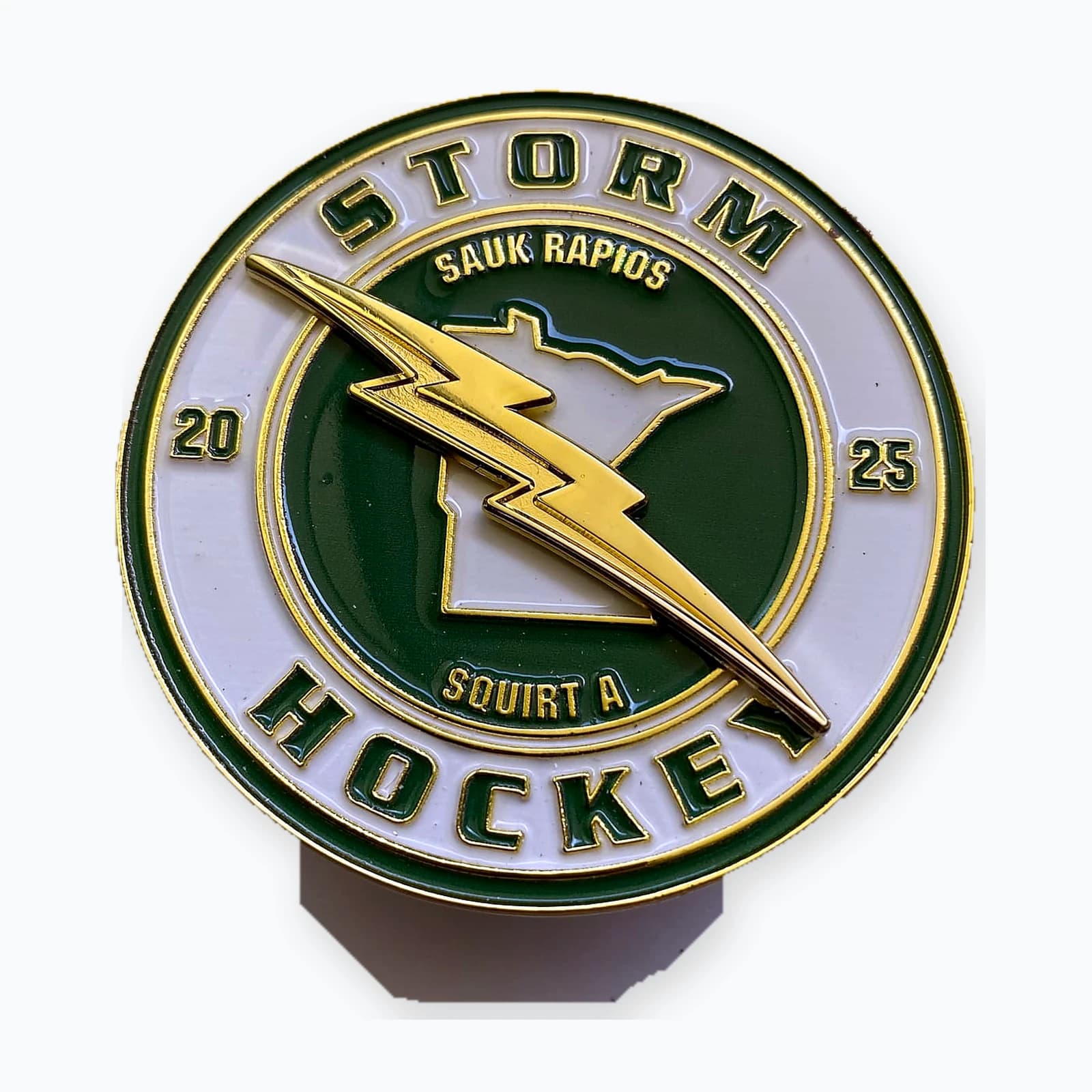 A round Grand Rapids Storm hockey trading pin